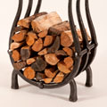 Log Basket with Wood. 2011, 46 x 26 x 16 inches - steel, clear paint, 140lbs. Photo: Trent Watts